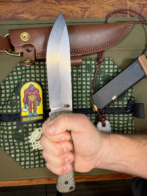 "6-inch bushcraft knife featuring 14C28N steel with cryogenic treatment, micarta handles, designed for durability and precision in outdoor adventures