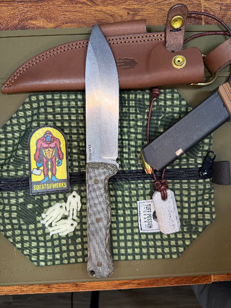 6-inch bushcraft knife with MagnaCut steel blade and durable Micarta handle, offering superior edge retention and grip for rugged outdoor use.