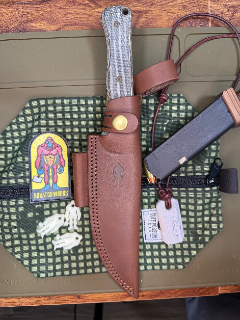 6-inch bushcraft knife with MagnaCut steel blade and durable Micarta handle, offering superior edge retention and grip for rugged outdoor use.