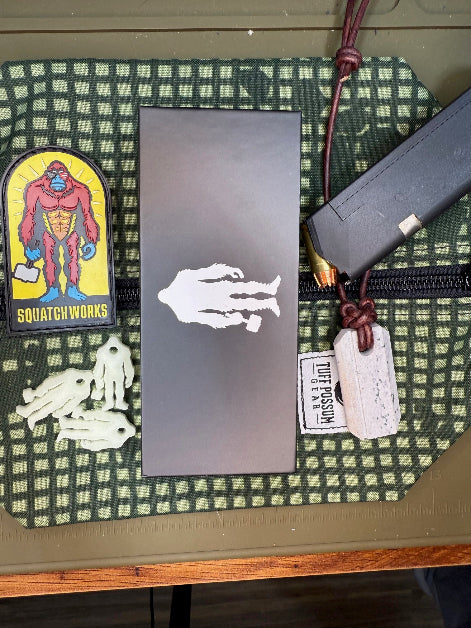 Folding knife with a cryo-treated 14C28N steel blade, featuring a durable Sasquatch-themed pocket clip and designed for everyday carry and outdoor performance.