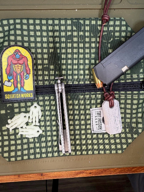 Folding knife with a cryo-treated 14C28N steel blade, featuring a durable Sasquatch-themed pocket clip and designed for everyday carry and outdoor performance.