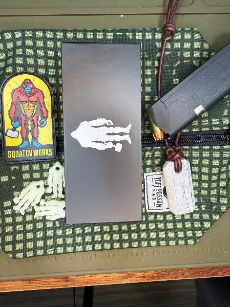 Folding knife with a MagnaCut steel blade, featuring a durable Sasquatch-themed pocket clip, Titanium handles, and designed for everyday carry and outdoor performance.