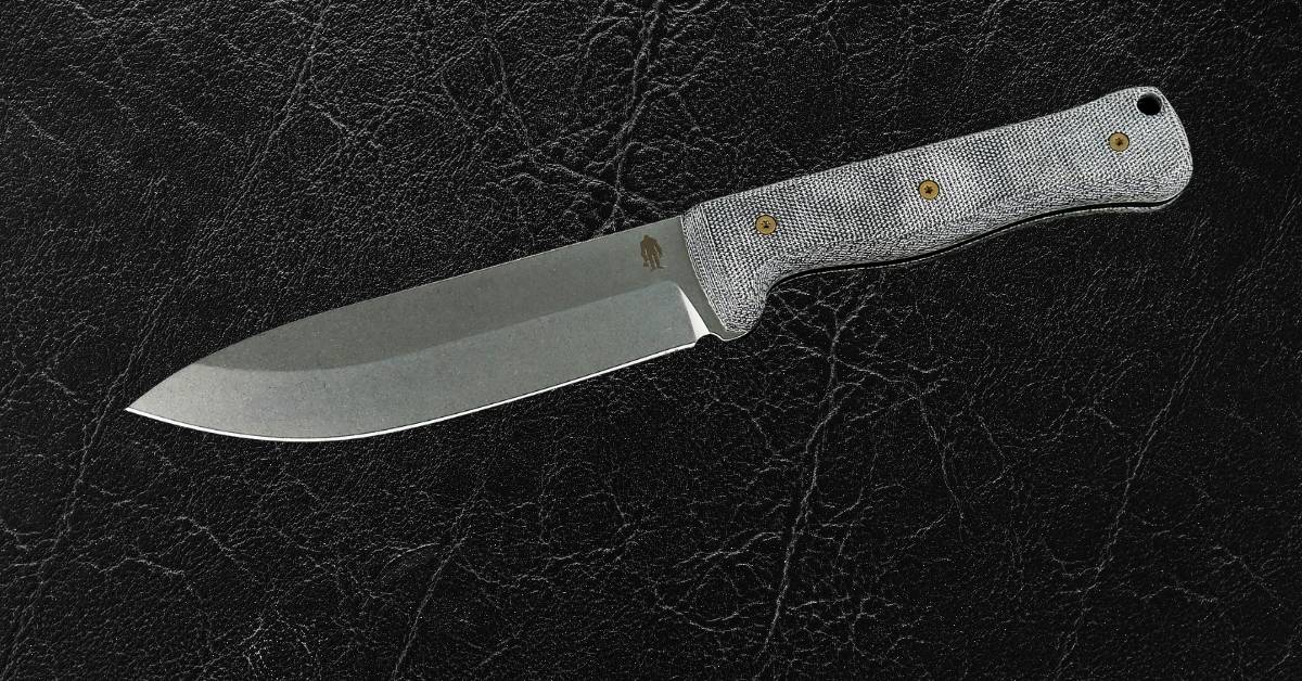 6-inch bushcraft knife with MagnaCut steel blade and durable Micarta handle, offering superior edge retention and grip for rugged outdoor use.