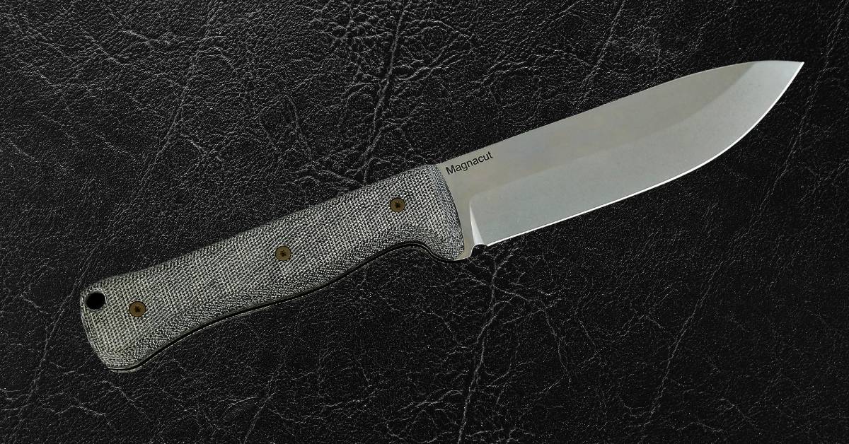 6-inch bushcraft knife with MagnaCut steel blade and durable Micarta handle, offering superior edge retention and grip for rugged outdoor use.